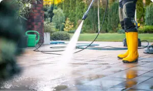 Pressure washing in yellow boots