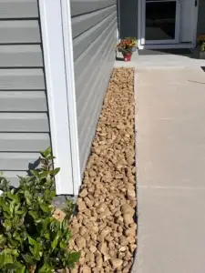 hardscaped entryway with medium-sized rocks