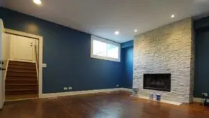 finished basement with blue painted walls